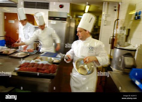 Chefs Working Hard In A Hot Kitchen Stock Photo Alamy