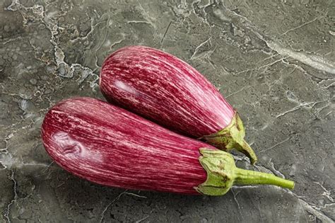 Premium Photo Two Ripe Purple Graffiti Eggplant For Cooking