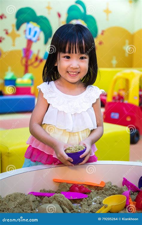 Happy Asian Chinese Little Girl Playing Kinetic Sand Indoor Stock Photo