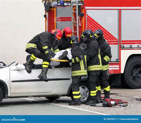 Firefighters Relieve An Injured After Car Accident Stock Image Image