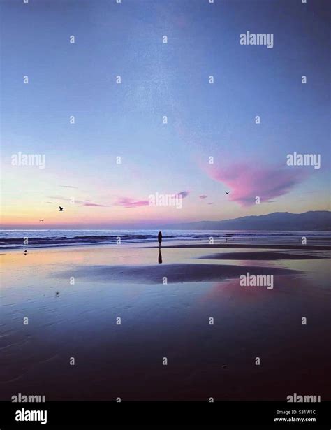 Beach at dusk Stock Photo - Alamy