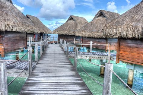 Royalty-Free photo: Brown huts above sea | PickPik