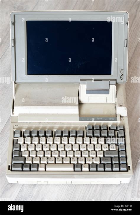 Very Old Laptop On A Light Wooden Base Stock Photo Alamy