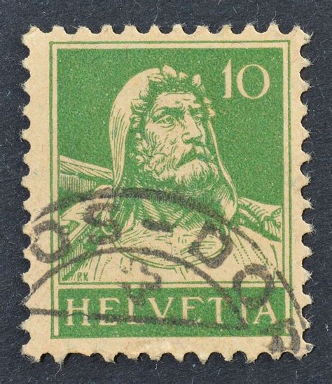 Postage Stamp Printed By Switzerland That Shows Man With A Crossbow