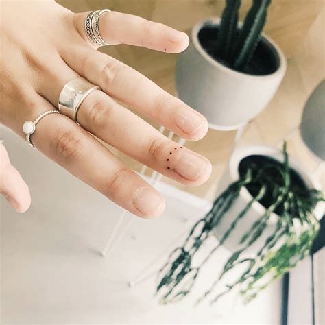 Tiny Finger Tattoo By Artist Cholo Tattoogrid Net