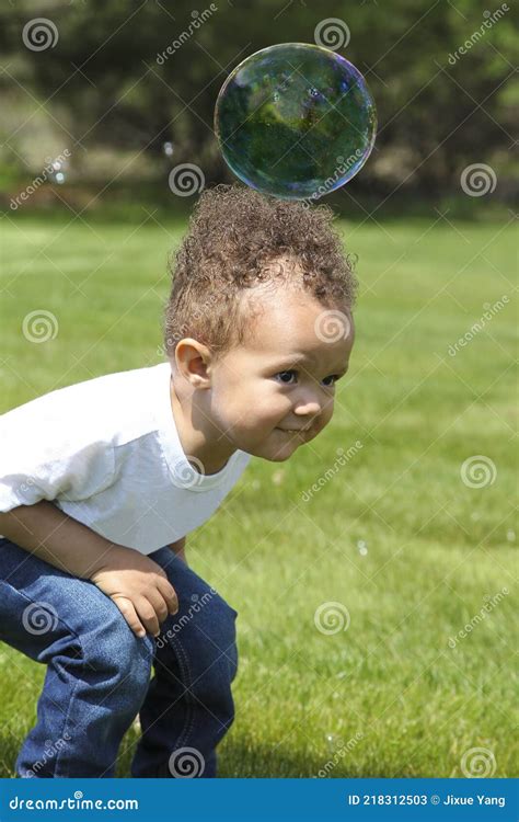 Heavy Bubble 2 Year Old Boy Plays With Bubbles At Backyard Stock Image