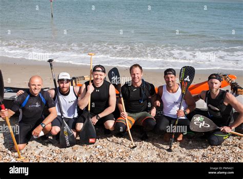 Group portrait of winners of a dragon boat race Stock Photo - Alamy