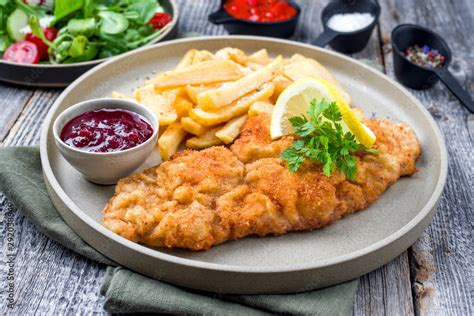 Deep Fried Wiener Schnitzel From Veal Topside With French Fries And