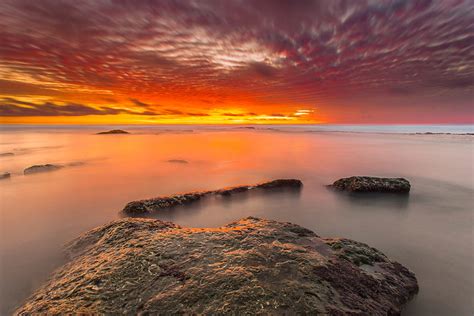 Sunset Stones Water Horizon Sky Hd Wallpaper Peakpx