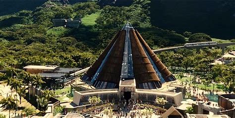 An Aerial View Of A Train Station In The Middle Of A Tropical Area With Palm Trees