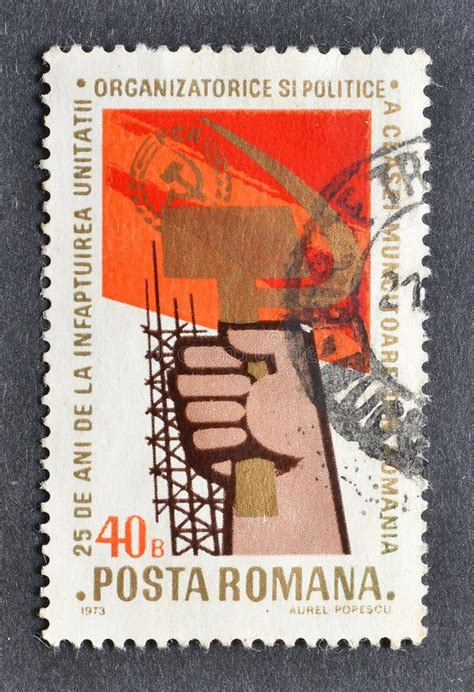 Cancelled Postage Stamp Printed By Romania That Shows Hand Holding