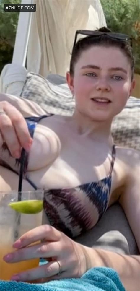 Thomasin Mckenzie In Sexy Bikini With Her Friend Lying On A Beach In