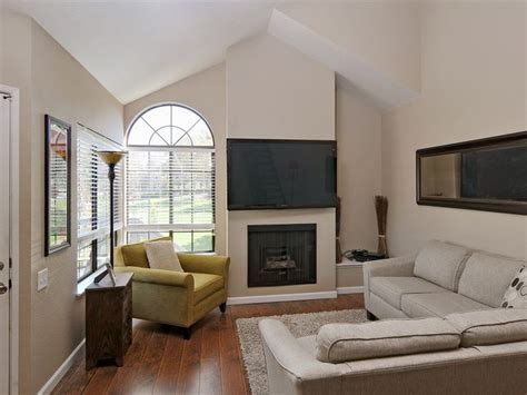 The Front Door Opens Up To A Bright Living Room With Fireplace