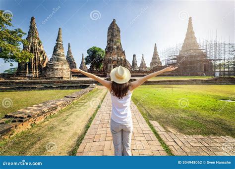 A Woman Stands In Front Of The Buddhistic Temple Ruins At Ayutthaya