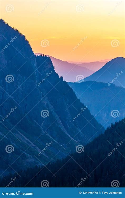 Hazy Blue And Orange Layered Mountain Sunset Stock Photo Image Of