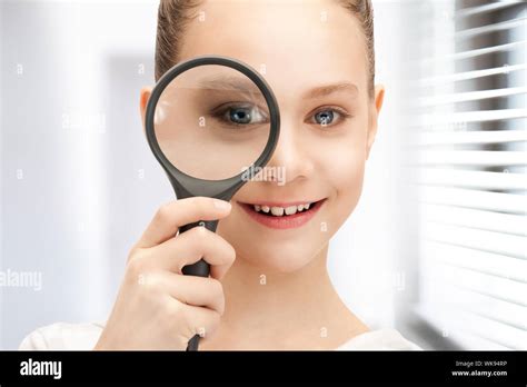 Picture Of Teenage Girl With Magnifying Glass Stock Photo Alamy