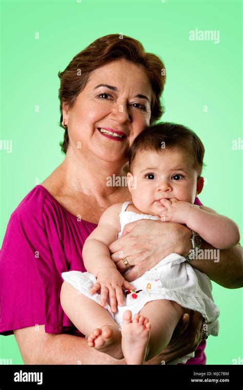 Beautiful Happy Senior Caucasian Hispanic Latina Grandmother Holding