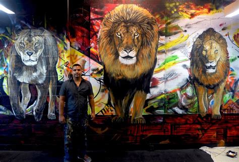 Piero Manrique In Front Of His Lion Mural At Body Chemistry Fitness