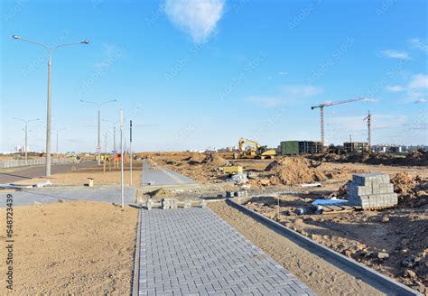 Paving Bricks At Construction Site Laying Paving Slabs And Borders In