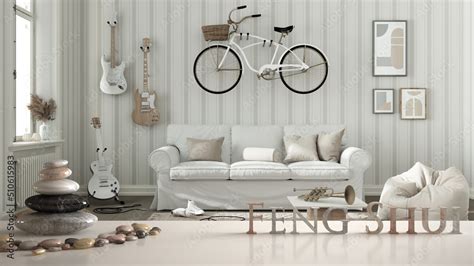 White Table Shelf With Pebble Balance And D Letters Making The Word