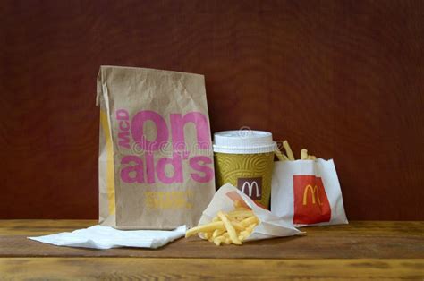 Mcdonald S Take Away Paper Bag And Junk Food On Wooden Table Editorial