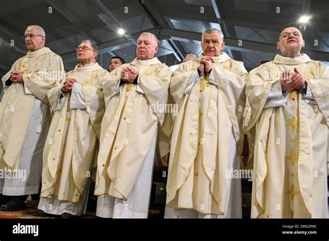 Catholic Priests In Liturgical Vestments Praying Christian Priests Praying In Cathedral