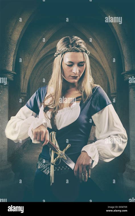 Medieval Woman Holding A Dagger Stock Photo Alamy