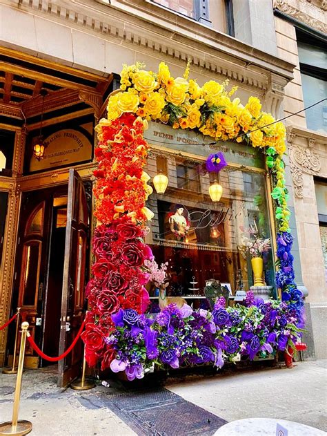 A Building Decorated With Flowers And Candles