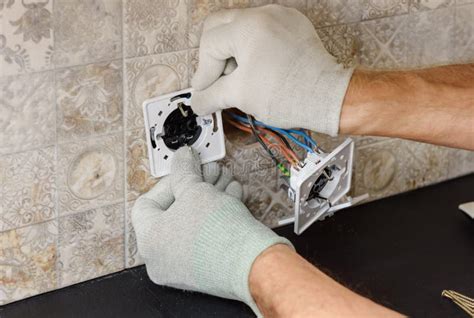 An Electrician is Installing Switches and Sockets Stock Image - Image ...