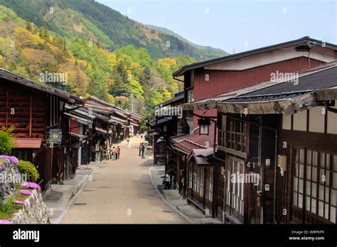 Visitors Stroll Along The Main Street In Narai A Post Town On The