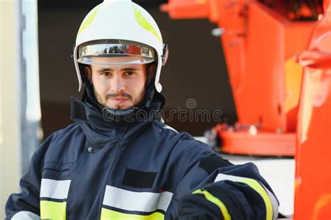 Photo Of Fireman With Gas Mask And Helmet Near Fire Engine Stock Image