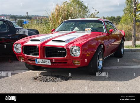 Front view of a classic red American sports muscle car with white ...