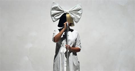 Why Does Sia Cover Her Face? Here's the Scoop