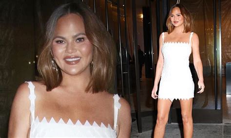 Chrissy Teigen Shows Off Her Toned Legs In White Minidress As She