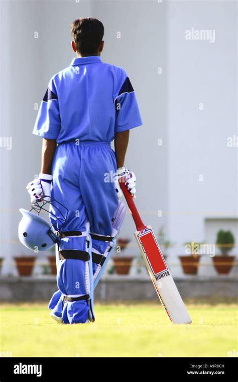 A batsman walking towards pavilion rear view Stock Photo - Alamy