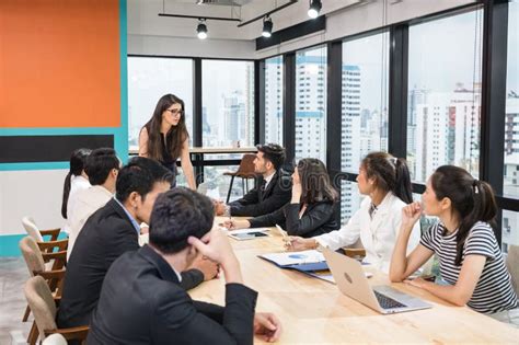 Caucasian Team Leader And Multiethnic Business Colleagues Meeting With