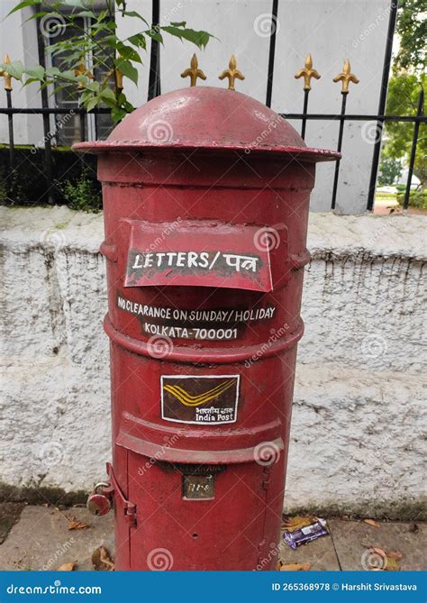 Red Colored Post Box Placed On The Street Operated By The Indian Postal