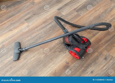 Vacuum Cleaner on the Wooden Floor. Cleaning Home Stock Image - Image ...