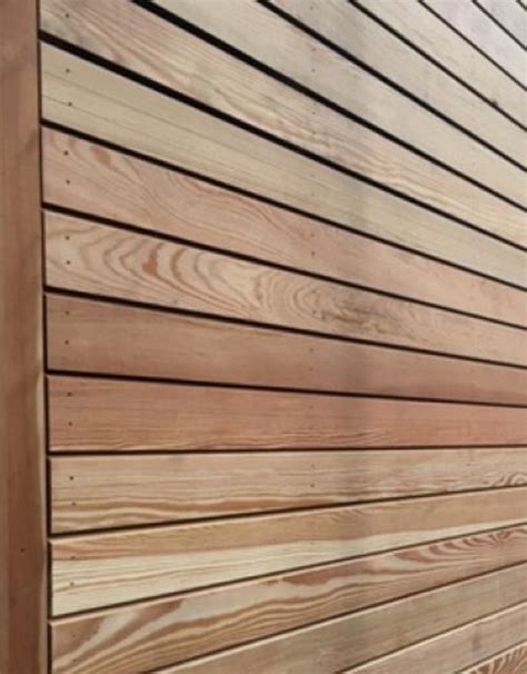 The Side Of A Wooden Building With Wood Slats