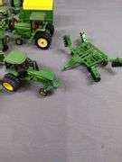 LOT OF MISC JOHN DEERE MINIATURE TRACTORS AND ATTACHMENTS EK