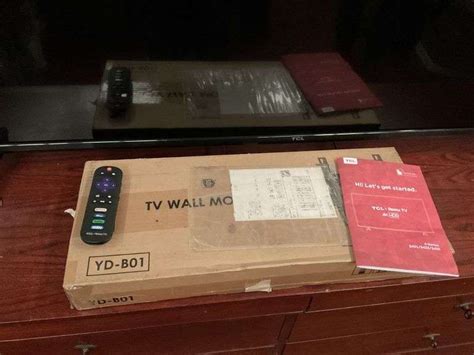 TCL 65" TV, new with wall mount and Vizio - Legacy Auction Company