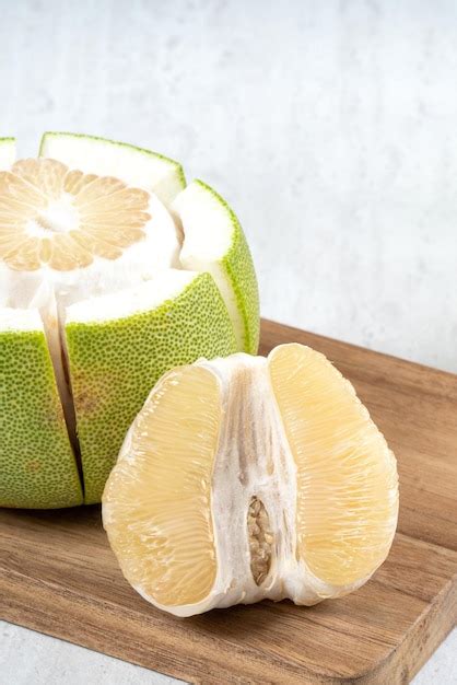 Premium Photo Fresh Pomelo Fruit On White Table Background