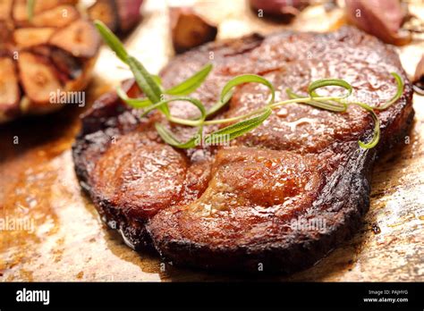 Fried Grilled Pork Neck With Garlic On Rustic Background Stock Photo