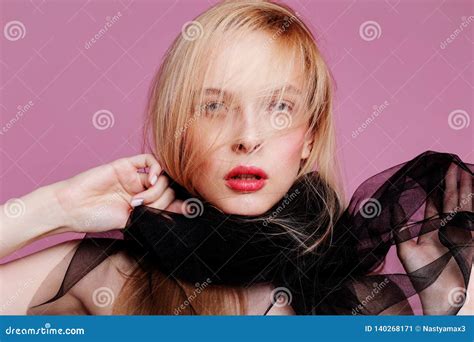 Blonde Young Woman In Elegant Body Girl Posing On A Pink Background Make Up And Hairstyle