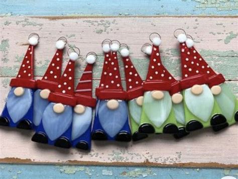 Six Colorful Glass Bottles With Polka Dots And Clown Hats Hanging From