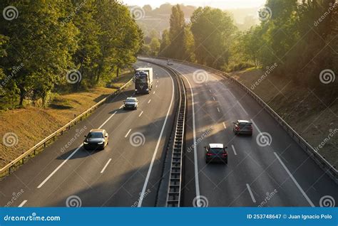 Cars Driving on the Road at Sunset Stock Image - Image of perspective ...