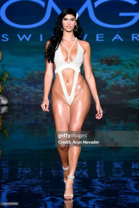 A Model Walks The Runway At The Omg Swimwear Show At Miami Swim Week