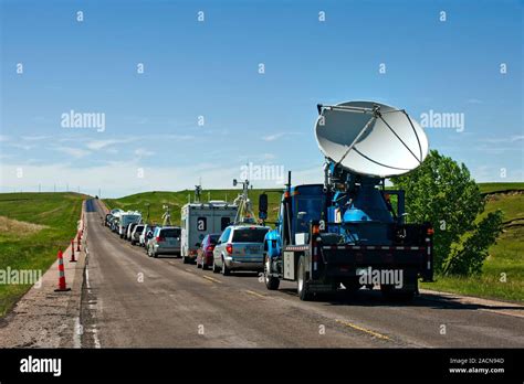 Storm chasing. VORTEX 2 vehicles in convoy, with a Doppler on Wheels ...