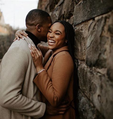 Engagement Photo Inspiration Couples Embrace Against Stone Wall