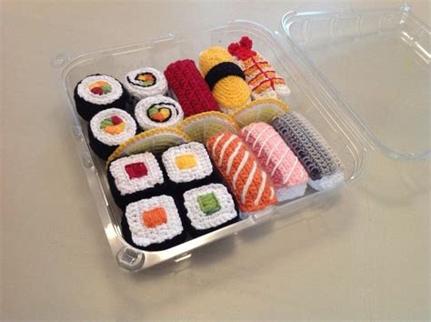 A Plastic Container Filled With Different Types Of Sushi